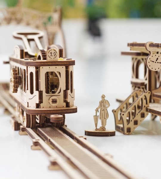 Ugears mechanical model kit Tram Line and wooden 3D puzzle. Street tramcar, ticket stop, depot, footbridge and characters. Original gift for boys and girls and smart hobby for grown-ups.